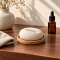 Corqena™ speckled ceramic aroma stone on an oak tray